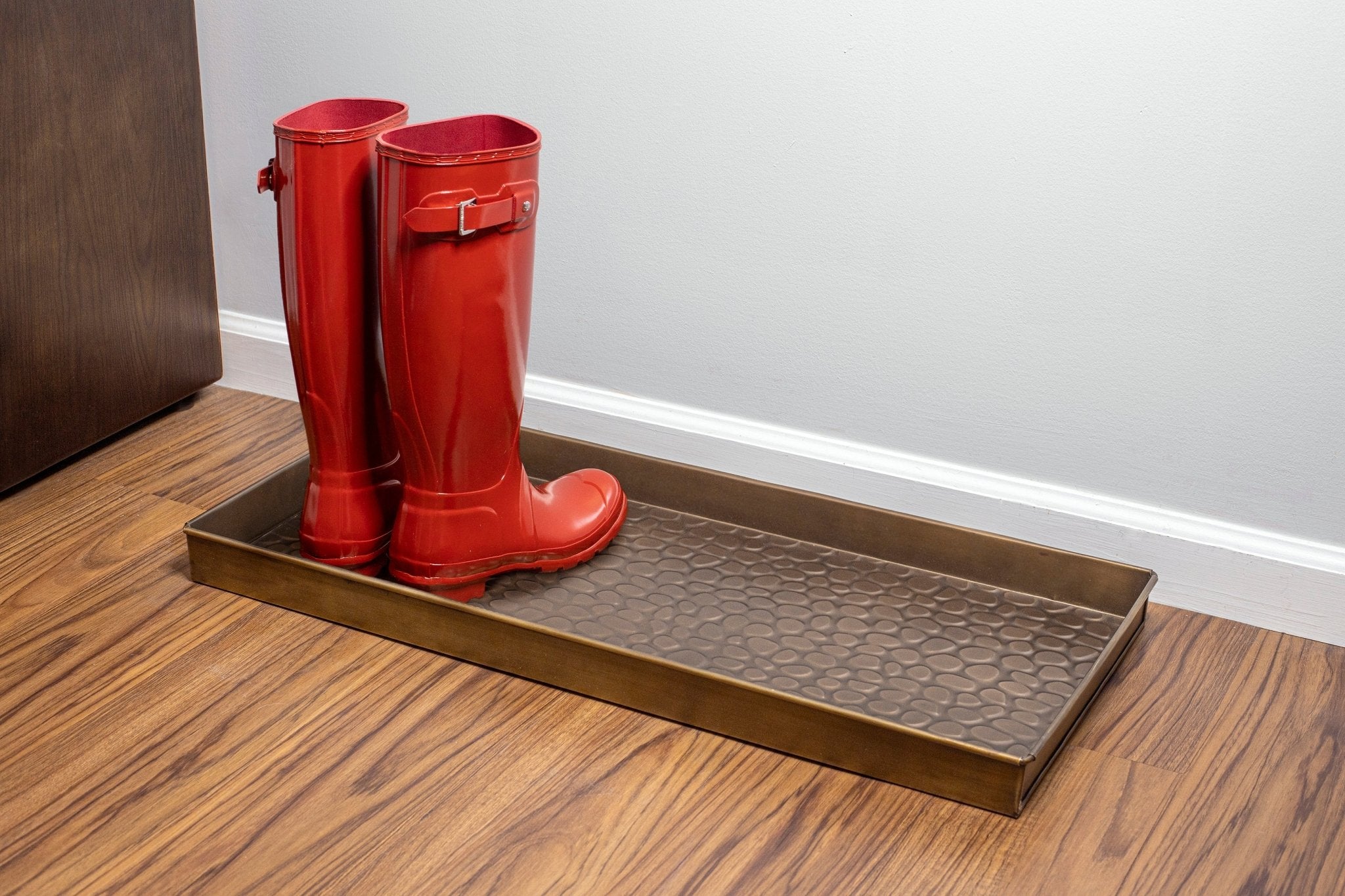 https://gooddirections.com/cdn/shop/products/208BR_Pebbles_Boot_Tray_CopperFinish_Glam4-640531.jpg?v=1702051349